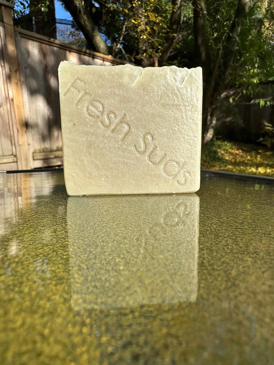 Rosemary Daydream soap bar, subtly scented and infused with Dead Sea Clay, presenting a harmonious mix of rosemary, green citrus, and English lavender for a gentle rejuvenating wash.