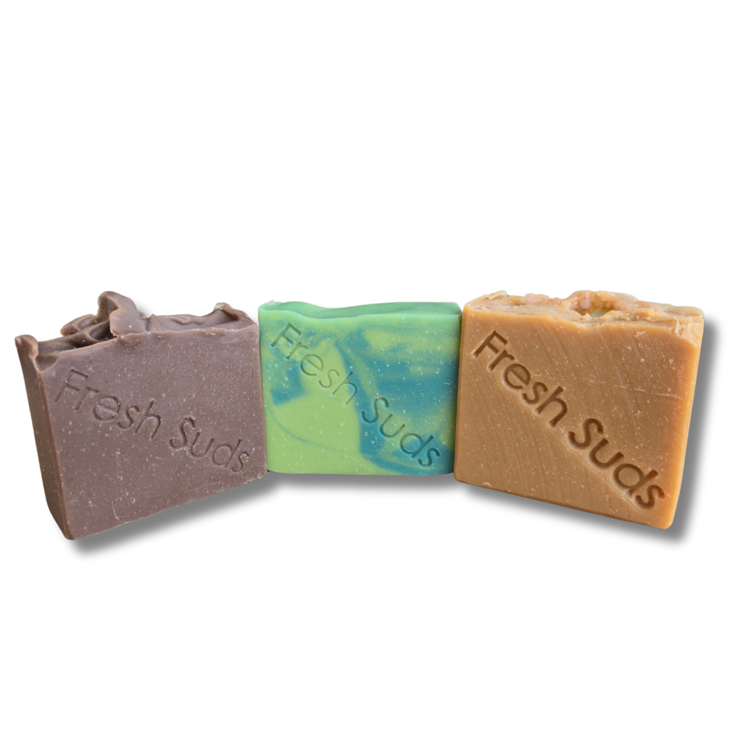 Woodland Bliss Bundle soap bars in brown, green and tan on white