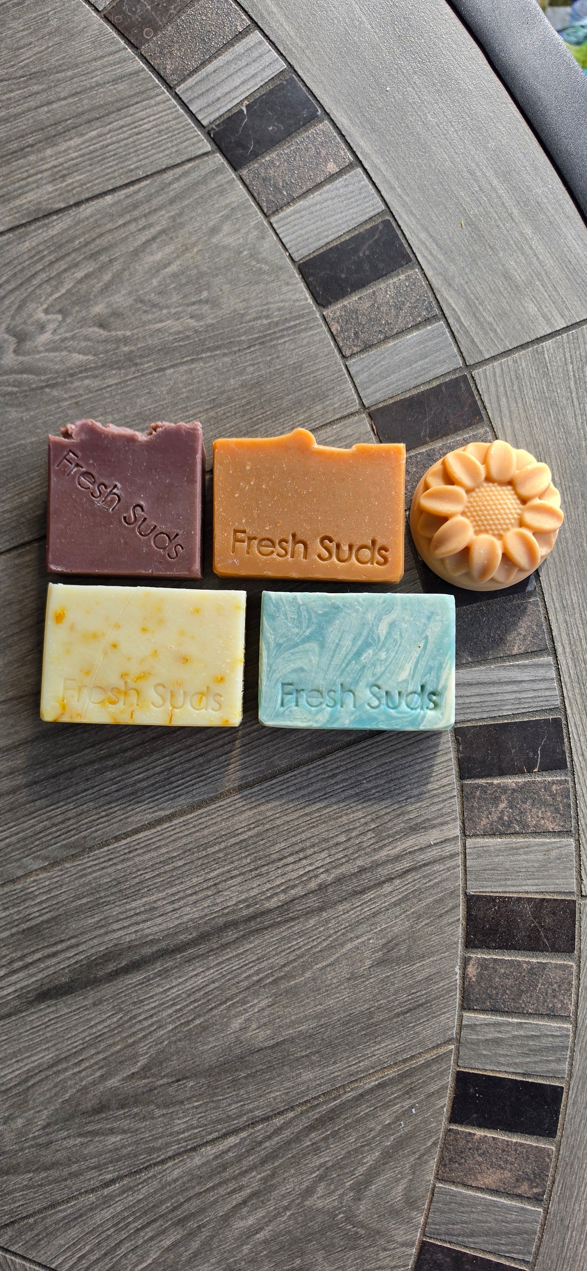 True North five-bar soap bundle laid flat on a stone table