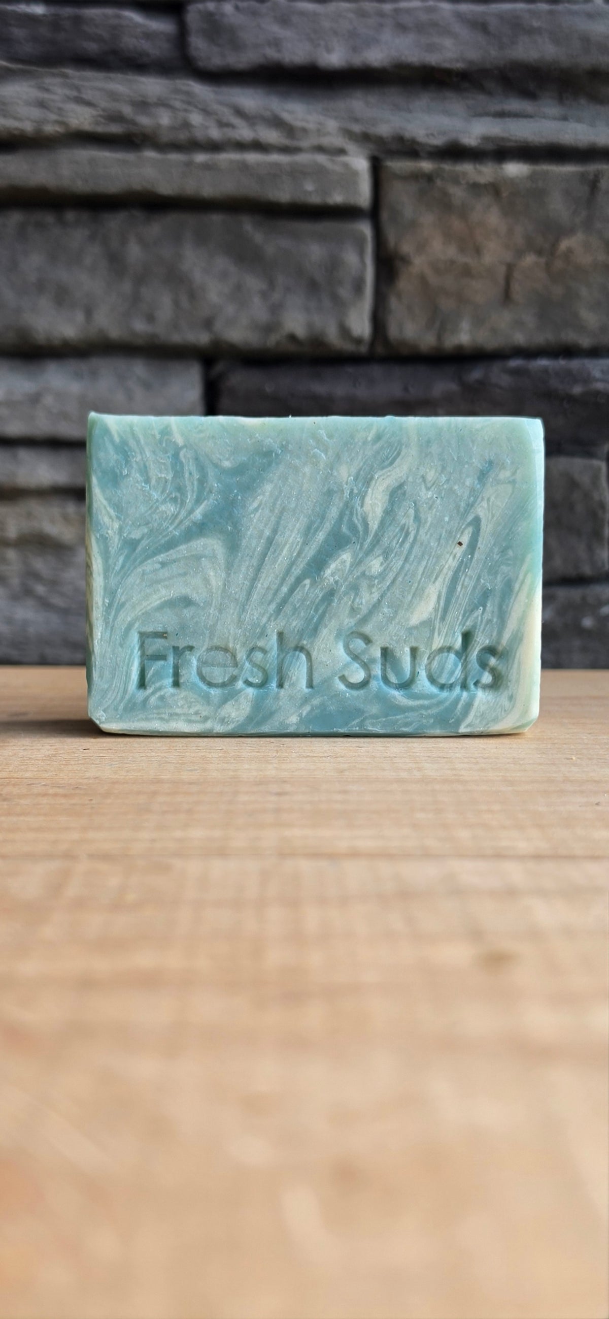 True North soap bundle on a wood table with the Glacier bar