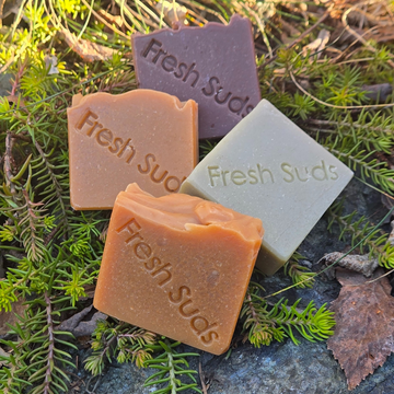 Gentle Detox Soap Bars - Four colourful soap bars outdoors on greenery - Fresh Suds Soapery