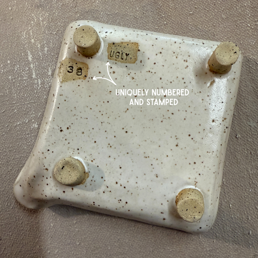 Whispering Cedar soap dish back showing artist signature and serial number"