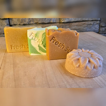 Fresh Favourites soap bundle, four real soap bars on a wood table