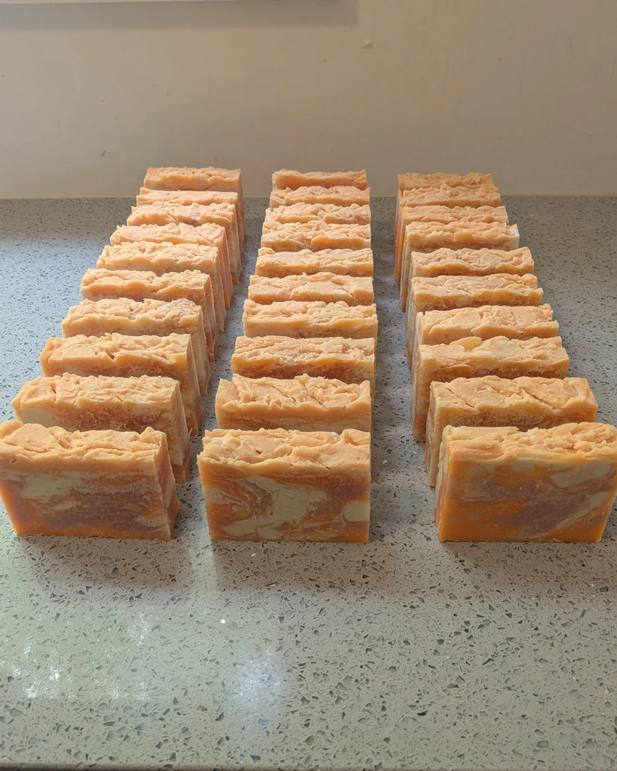 The Suds Circle welcome package — two soap bars, a personal card, a referral card, and member access