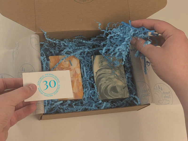 Nat hand-assembling The Suds Circle welcome packages