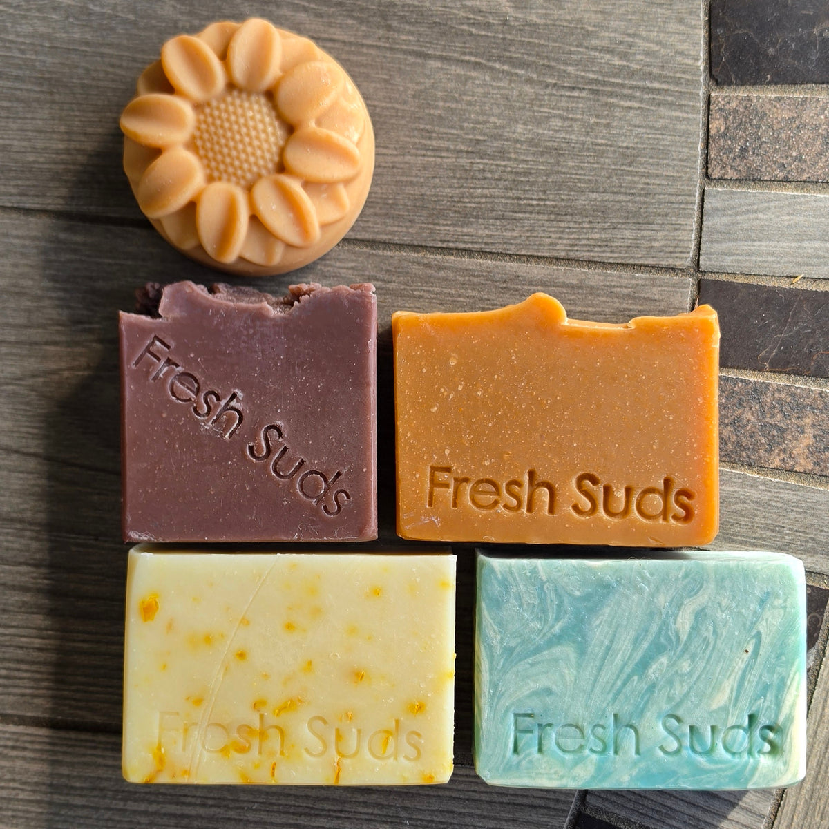 True North five-bar soap bundle on a stone table, real product photo