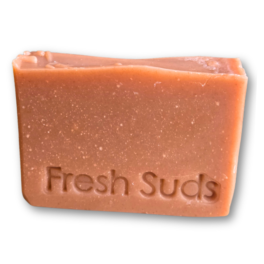Youthful Glow Rosehip soap bar in a wildflower and berry meadow